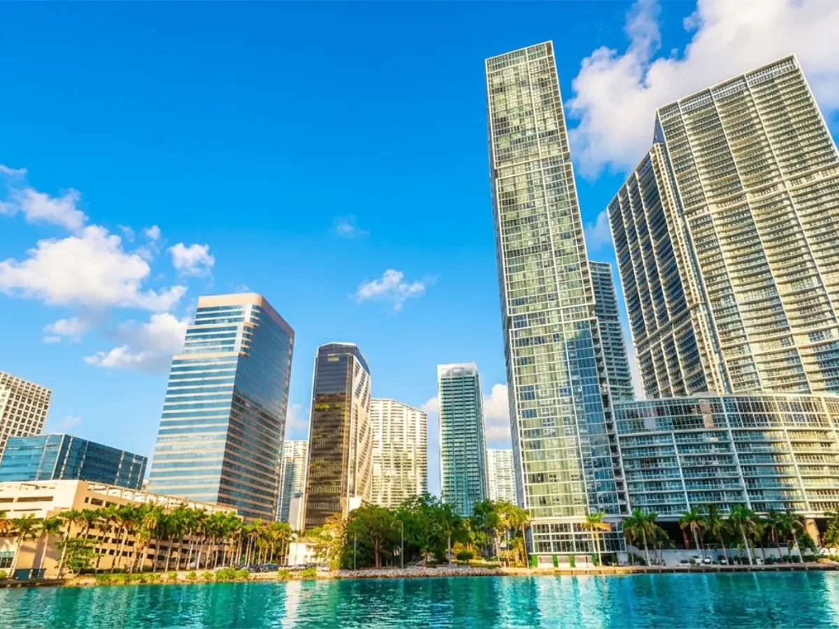 Panoramic view of the Brickell Miami skyline featuring modern luxury high-rise condos along Biscayne Bay and the Miami River, representing the city's financial heart.