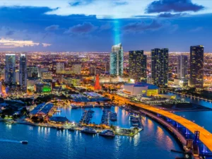 Dynamic cityscape of Downtown Miami featuring the Miami Worldcenter and Park West districts, showcasing modern high-rise luxury living and urban connectivity.